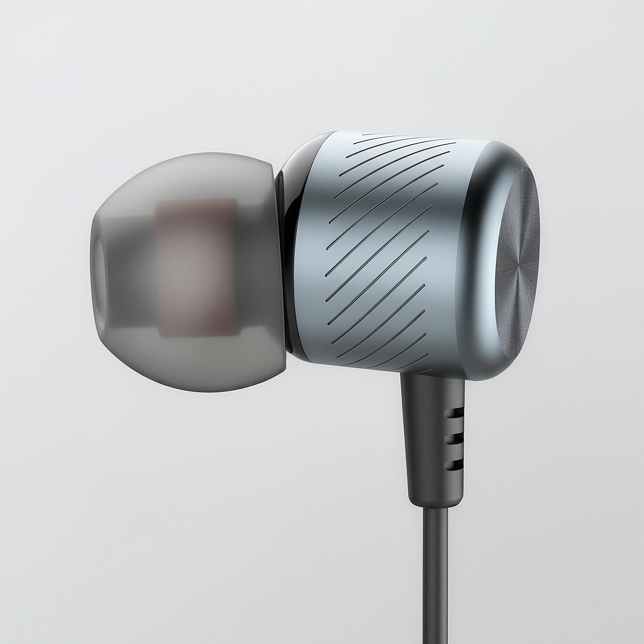 Silver in-ear headphones on a light gray background